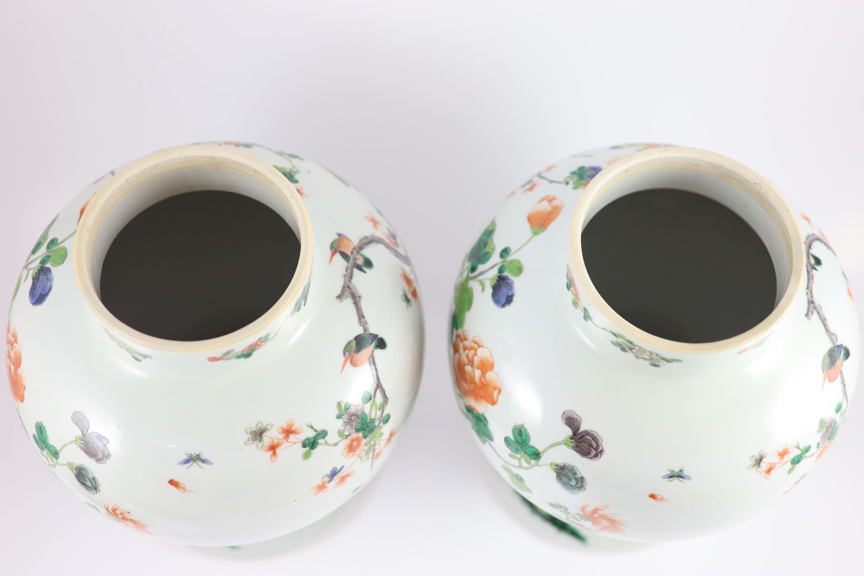 A pair of large Chinese famille verte jars and covers, late 19th century, 45cm high, restorations